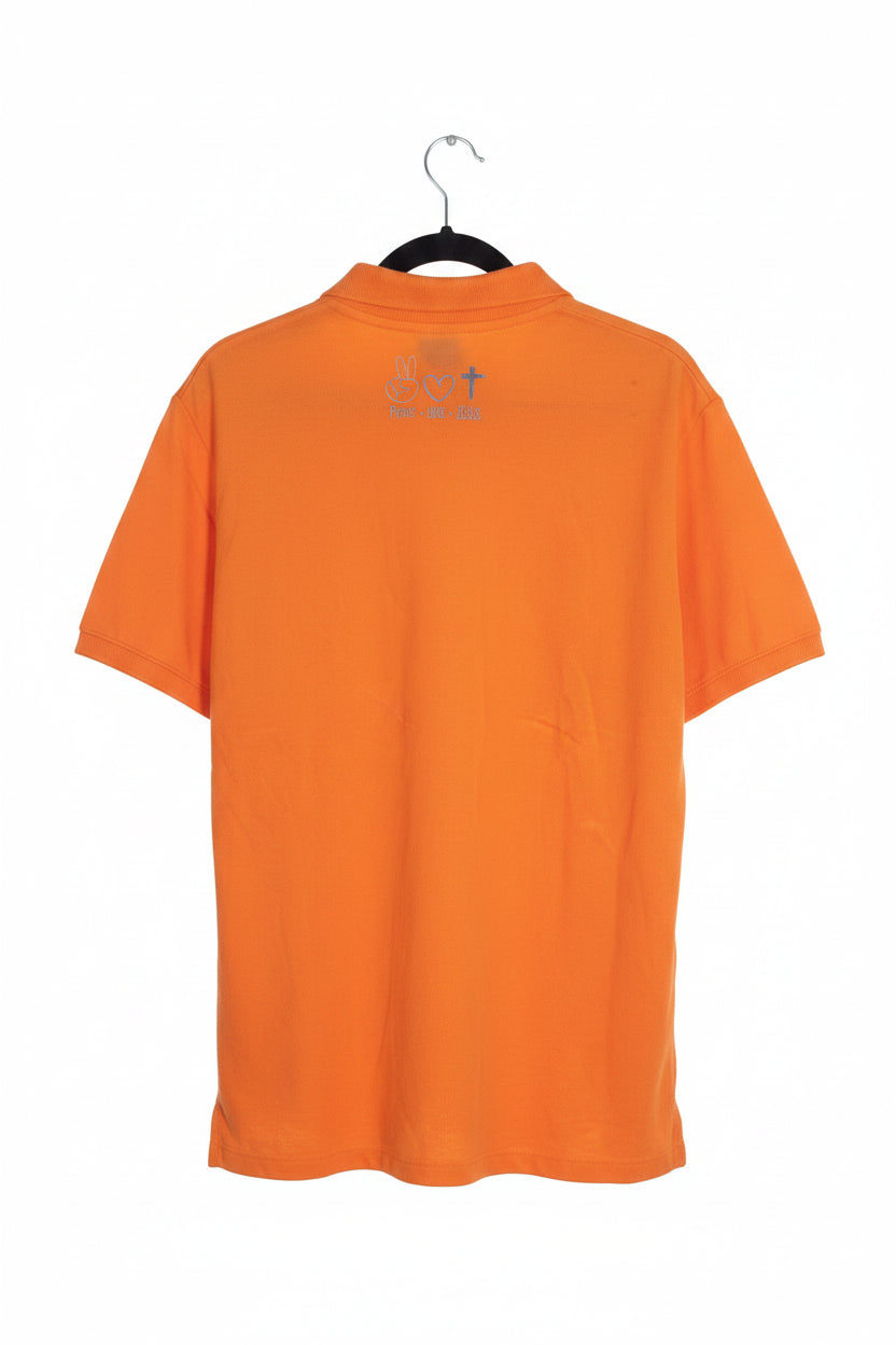 An orange short-sleeve polo shirt hanging on a black hanger, featuring a small graphic print on the upper back with a cross and text.
